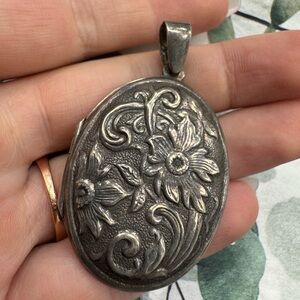 Antique Sterling silver floral pendant locket
